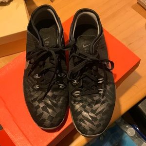 Black and silver Nike Free 5.0